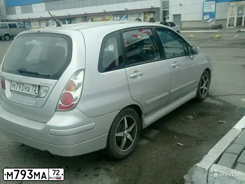 Фото автомобиля MITSUBISHI LANCER, 2008 — госномер О652МС72. Цвет: Красный