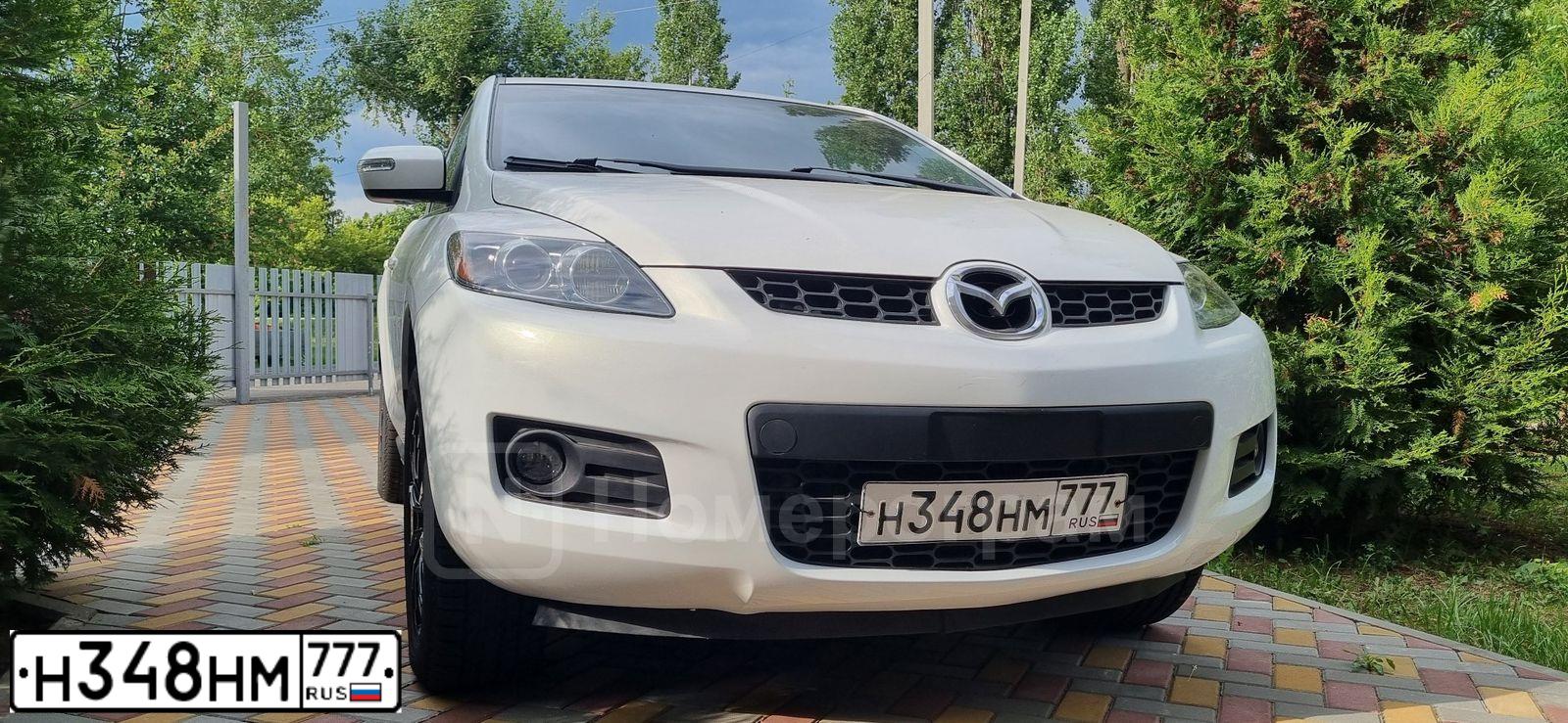Фото автомобиля MAZDA CX-7, 2008 — госномер Т018ХС77. Цвет: Белый