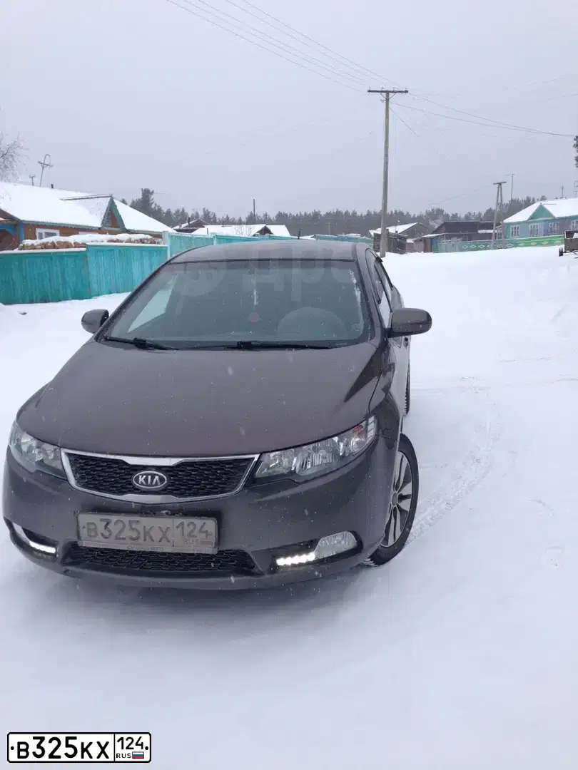 Фото автомобиля KIA CERATO, 2012 — госномер В325КХ124. Цвет: ЗОЛОТОЙ