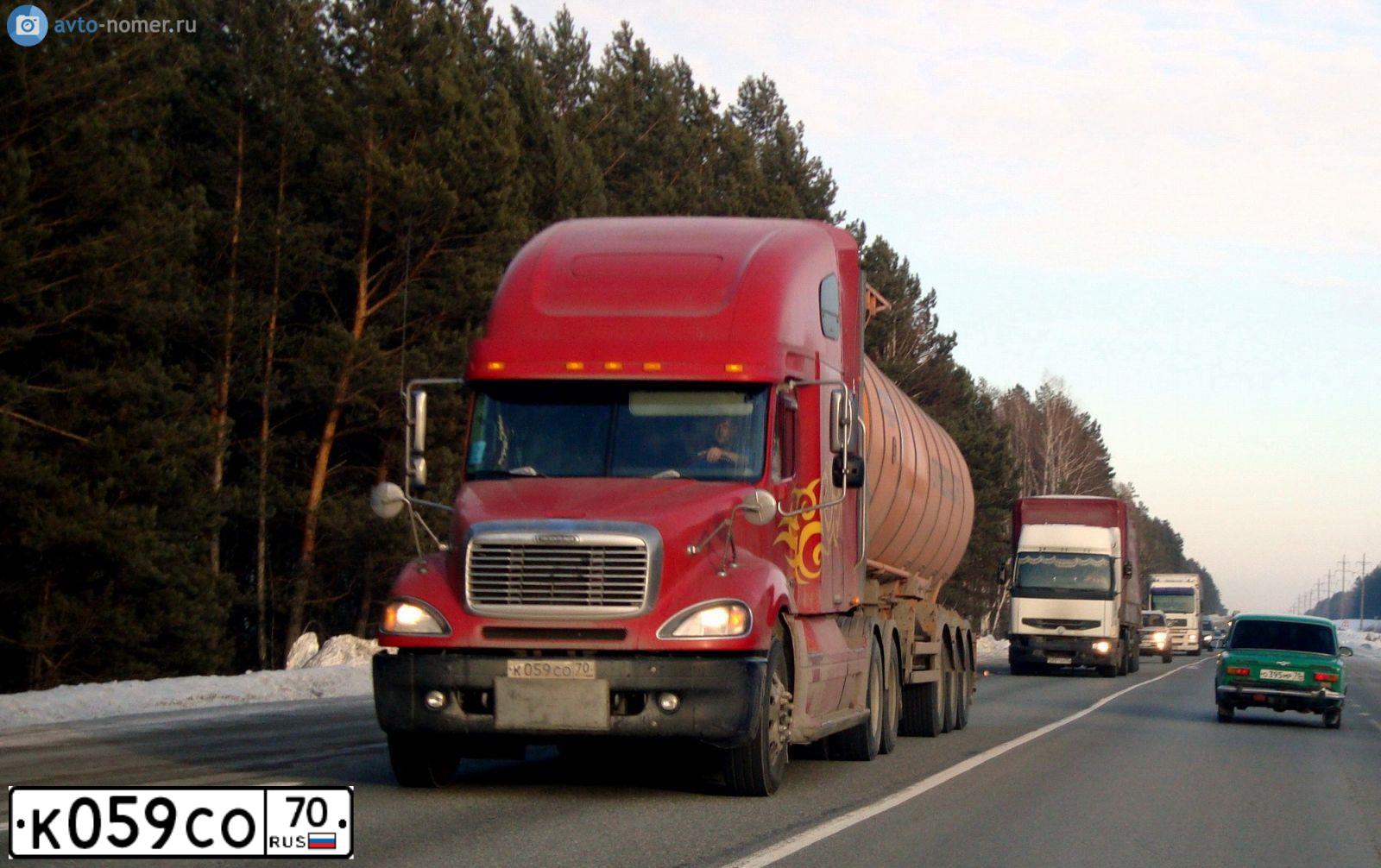 Фото автомобиля FREIGHTLINER COLUMBIA, 2003 — госномер К059СО70. Цвет: Красный