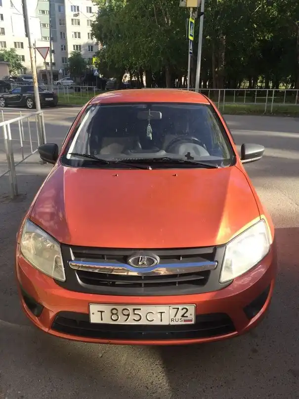 Фото автомобиля LADA GRANTA, 2014 — госномер О661ХА159. Цвет: Оранжевый