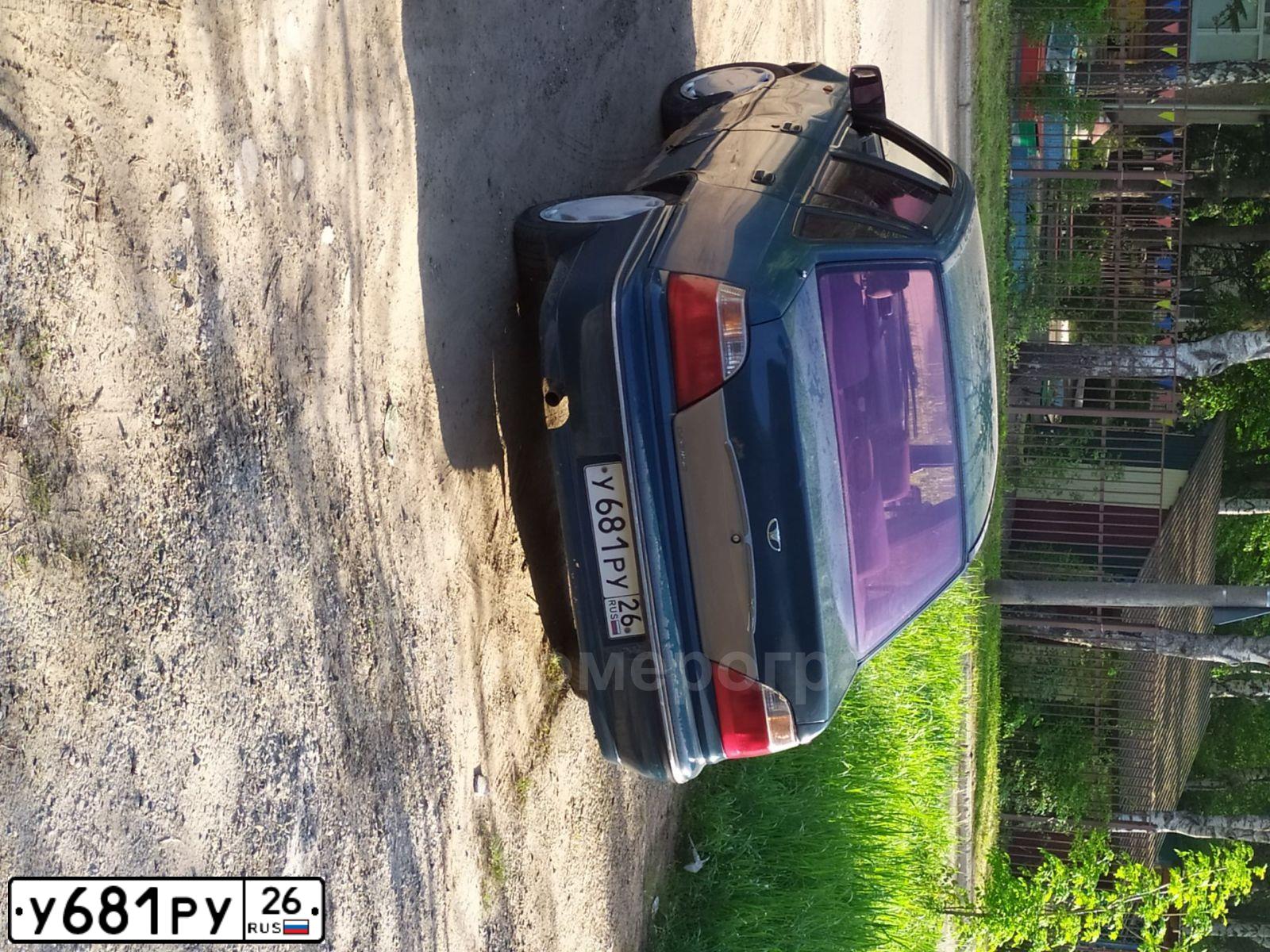 Фото автомобиля DAEWOO NEXIA, 2004 — госномер Х411РС90. Цвет: ЗЕЛЕНЫЙ СИНИЙ