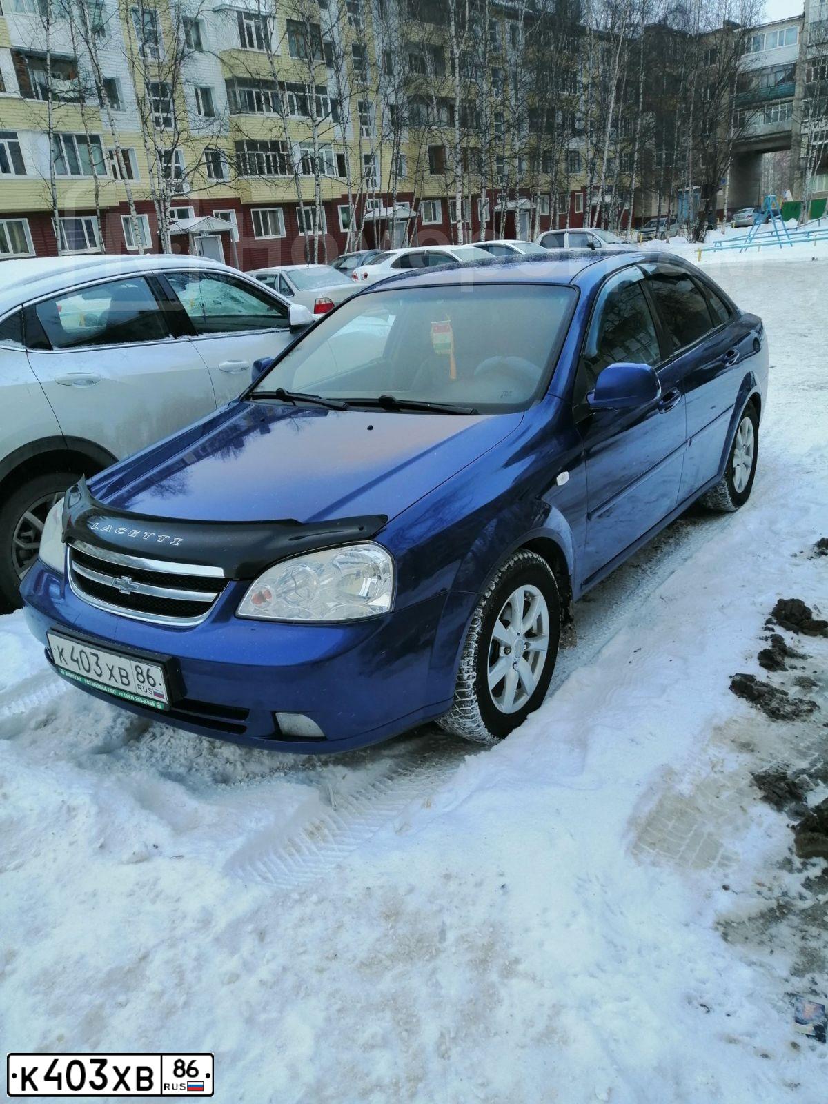 Фото автомобиля CHEVROLET LACETTI, 2011 — госномер К403ХВ86. Цвет: СИНИЙ