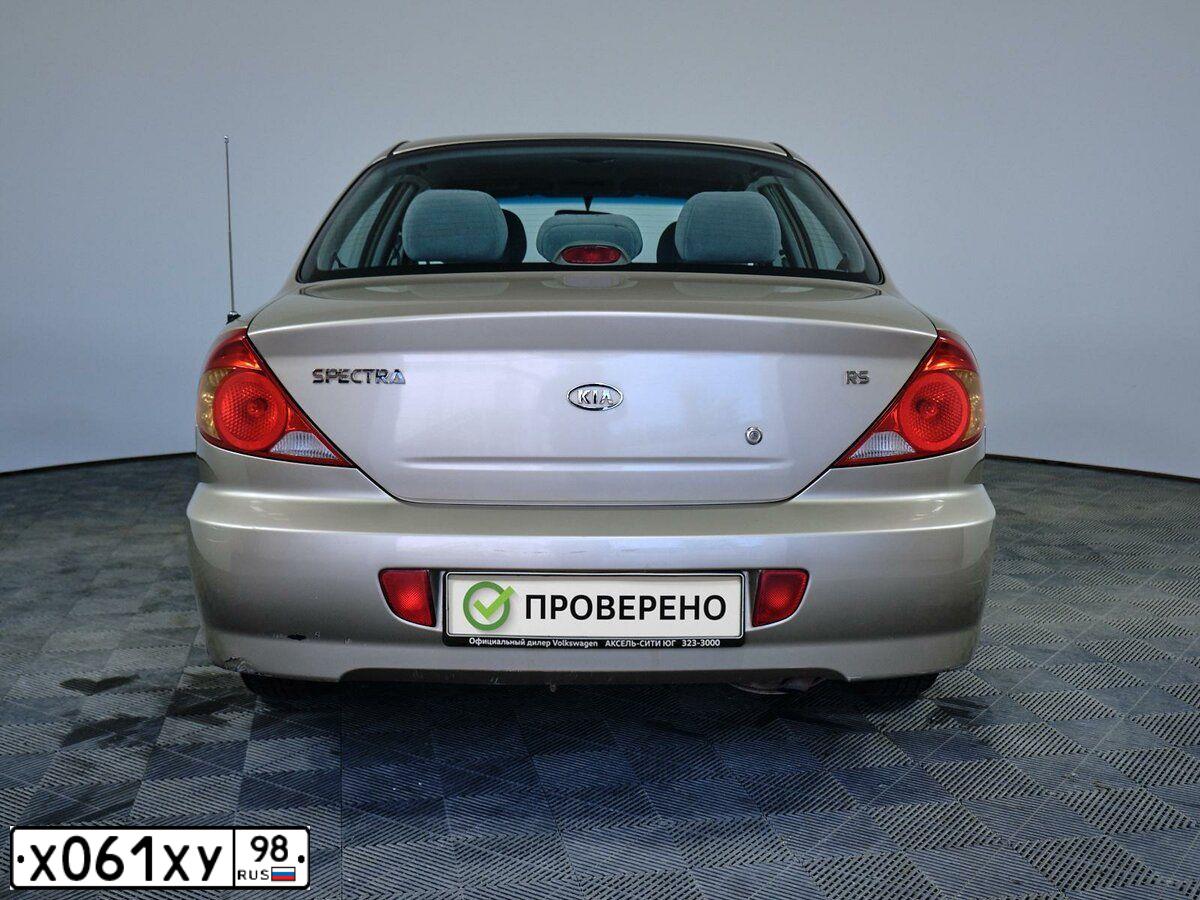 Фото автомобиля KIA SPECTRA, 2009 — госномер М472АХ35. Цвет: Золотисто-бежевый