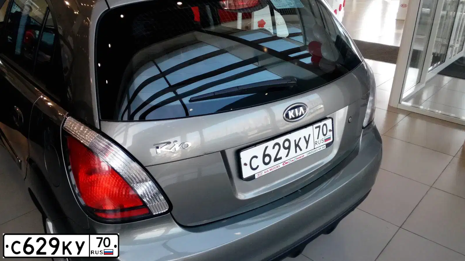 Фото автомобиля KIA RIO, 2011 — госномер С629КУ70. Цвет: СЕРЫЙ