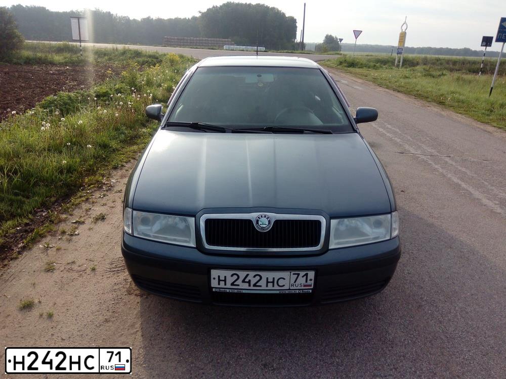 Фото автомобиля SKODA OCTAVIA, 2006 — госномер Н242НС71. Цвет: СЕРЫЙ