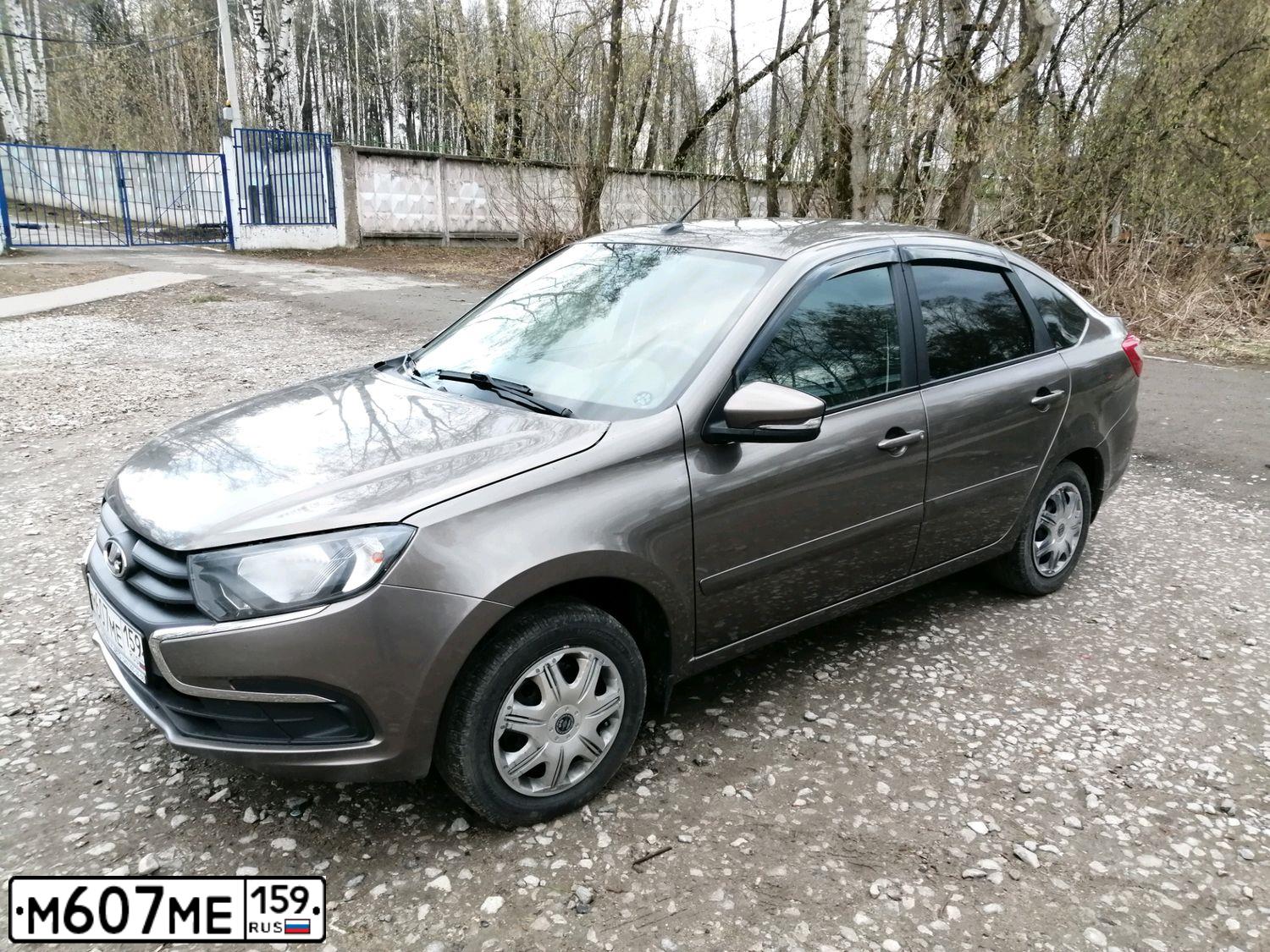 Фото автомобиля LADA 2191 GRANTA, 2018 — госномер М607МЕ159. Цвет: Золотисто-коричневый