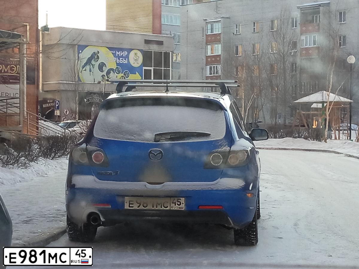 Фото автомобиля MAZDA 3, 2005 — госномер Е981МС45. Цвет: СВЕТЛО-СИНИЙ