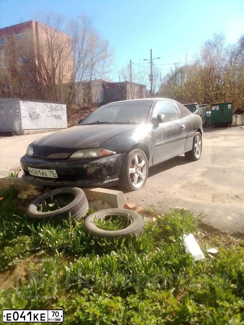 Фото автомобиля TOYOTA CAVALIER, 1997 — госномер Е041КЕ70. Цвет: ЧЕРНЫЙ