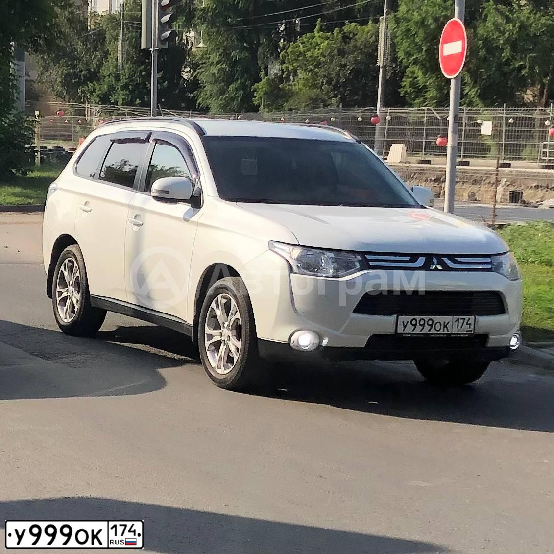 Фото автомобиля MITSUBISHI OUTLANDER, 2010 — госномер У440МО45. Цвет: синий