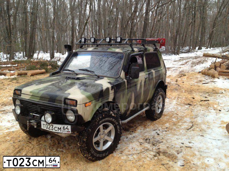 Фото автомобиля LADA 2121 NIVA, 1999 — госномер Т023СМ64. Цвет: КОМБИНИРОВАННЫЙ