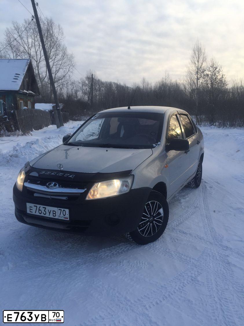 Фото автомобиля LADA 2190 GRANTA, 2014 — госномер К031ХА154. Цвет: Серебристый