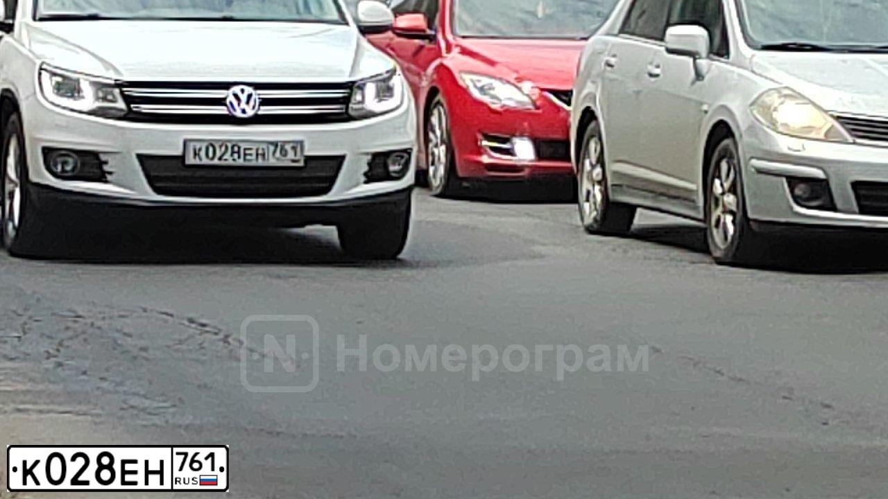 Фото автомобиля VOLKSWAGEN TIGUAN, 2011 — госномер К028ЕН761. Цвет: Белый