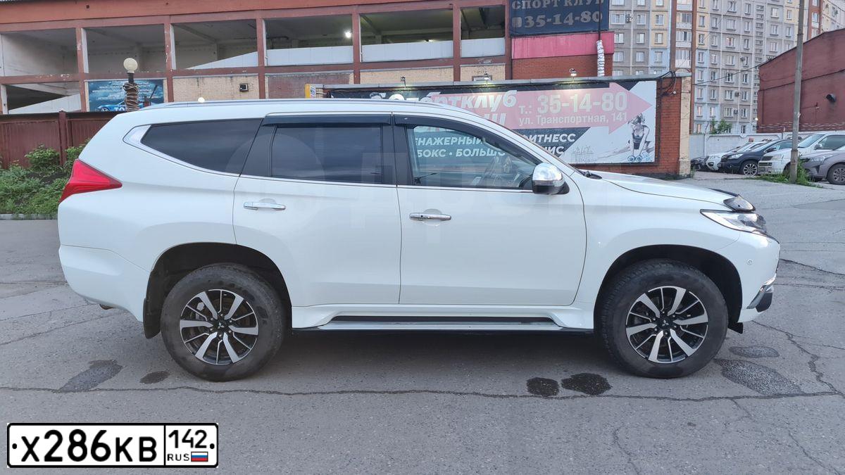 Фото автомобиля MITSUBISHI PAJERO SPORT, 2017 — госномер Х286КВ142. Цвет: Белый