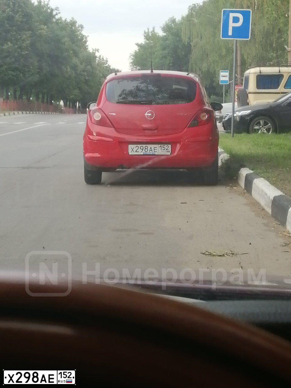Фото автомобиля OPEL CORSA, 2007 — госномер Х298АЕ152. Цвет: Красный