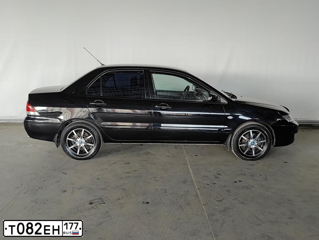 Фото автомобиля MITSUBISHI LANCER, 2005 — госномер Т414ТА797. Цвет: ЧЕРНЫЙ