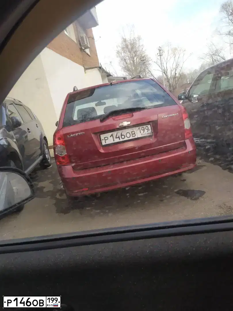 Фото автомобиля CHEVROLET LACETTI, 2008 — госномер Р146ОВ199. Цвет: КРАСНЫЙ