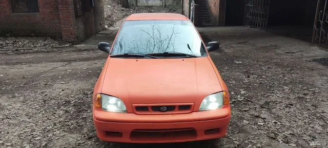 Фото автомобиля SUBARU JUSTY, 1998 — госномер Р730ЕК790. Цвет: Красный