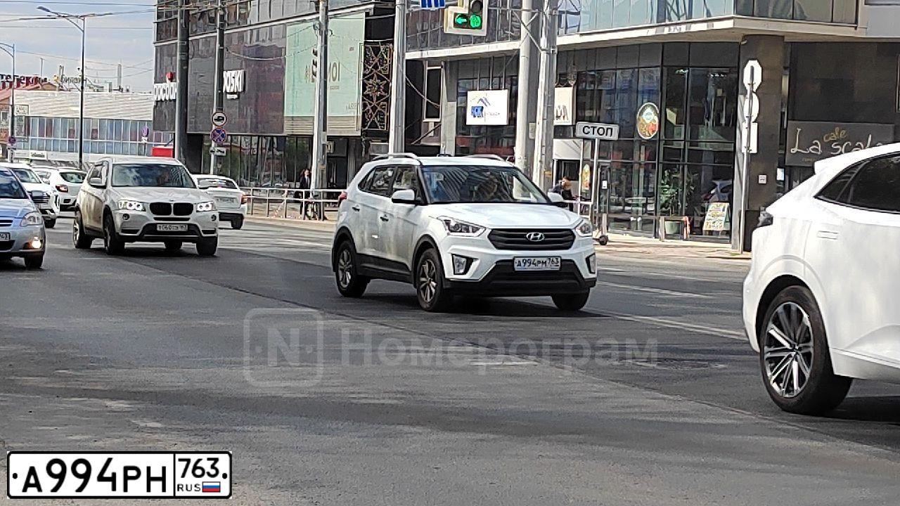 Фото автомобиля RENAULT LOGAN, 2018 — госномер Т208ВЕ797. Цвет: Белый