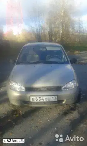 Фото автомобиля LADA 1118 KALINA, 2006 — госномер Е634ХЕ10. Цвет: БЕЖЕВО-СЕРЫЙ