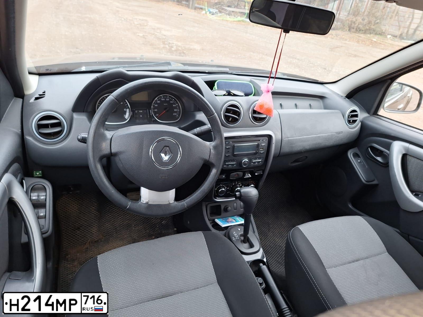 Фото автомобиля RENAULT DUSTER, 2012 — госномер Н214МР716. Цвет: Коричневый