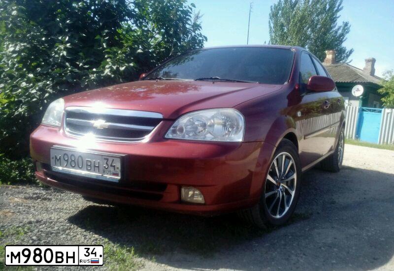 Фото автомобиля CHEVROLET LACETTI, 2007 — госномер Н134КК134. Цвет: Красный