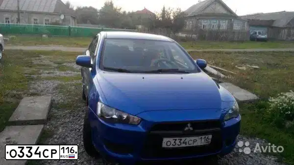Фото автомобиля MITSUBISHI LANCER, 2010 — госномер О334СР116. Цвет: СИНИЙ