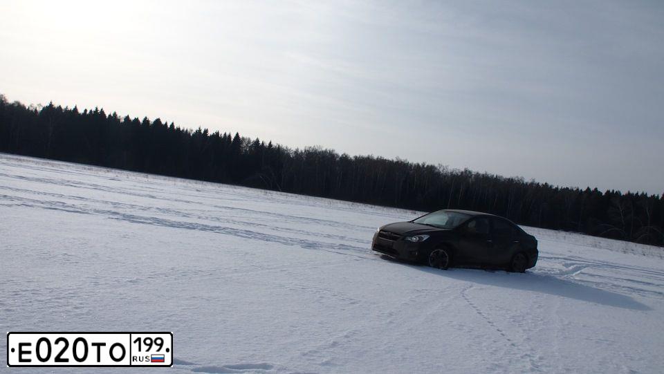 Фото автомобиля SUBARU IMPREZA, 2012 — госномер Е020ТО199. Цвет: ЧЕРНЫЙ