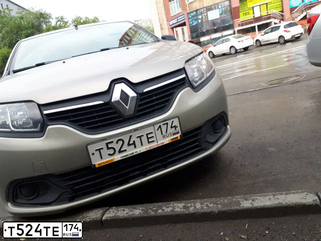 Фото автомобиля RENAULT LOGAN, 2015 — госномер Т524ТЕ174. Цвет: БЕЖЕВЫЙ