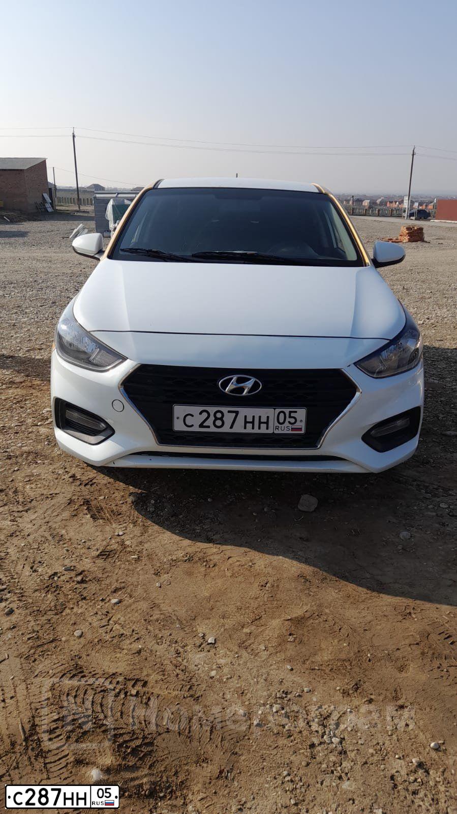 Фото автомобиля HYUNDAI SOLARIS, 2017 — госномер С287НН05. Цвет: БЕЛЫЙ