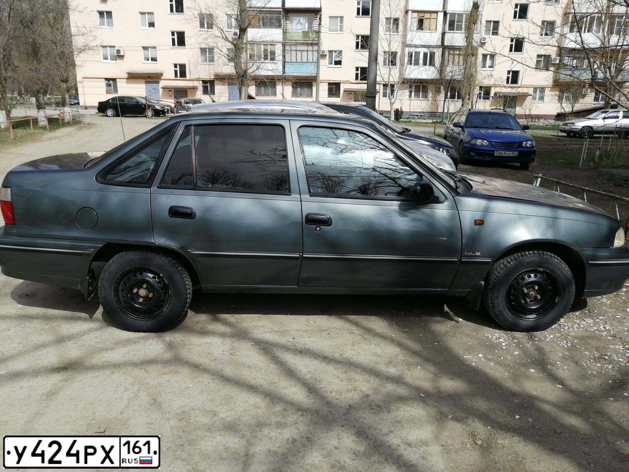 Фото автомобиля DAEWOO NEXIA, 2005 — госномер У424РХ161. Цвет: СЕРО-ЗЕЛЕНЫЙ