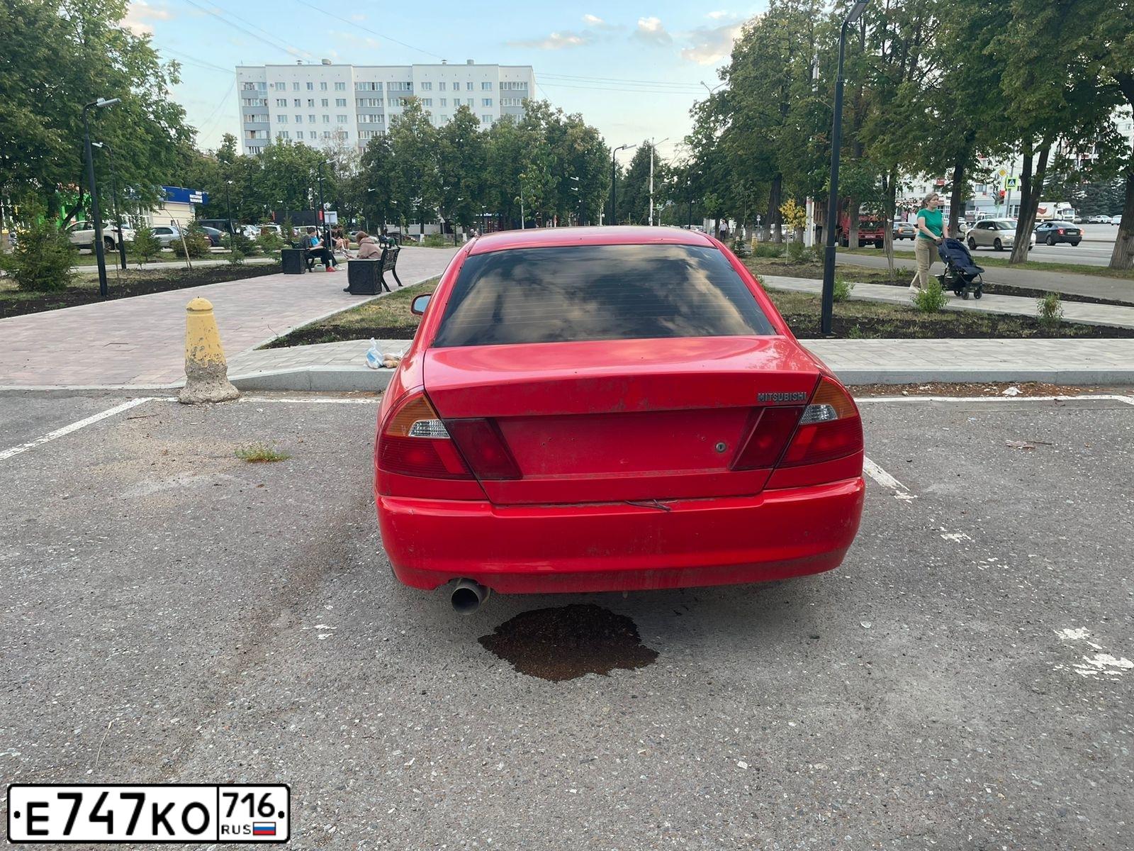 Фото автомобиля MITSUBISHI LANCER, 1999 — госномер Н339МВ702. Цвет: ТЕМНО-КРАСНЫЙ