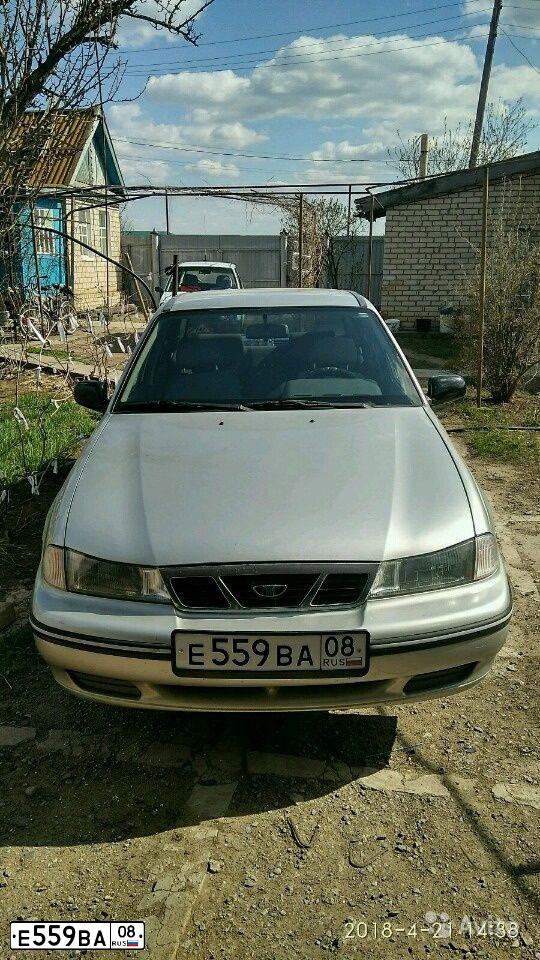 Фото автомобиля DAEWOO NEXIA, 2005 — госномер С201РТ34. Цвет: Серебристый