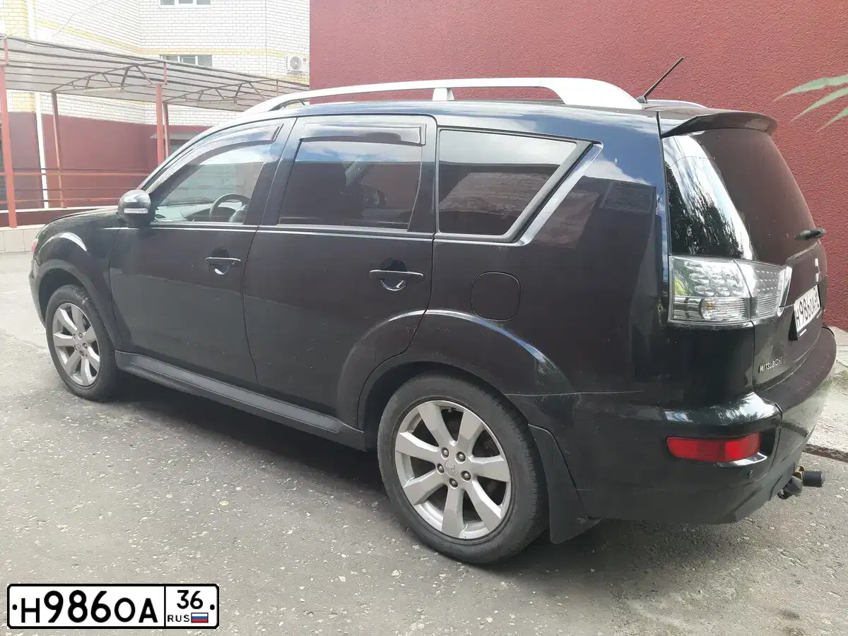 Фото автомобиля MITSUBISHI LANCER, 2007 — госномер Х020МТ36. Цвет: серебристый