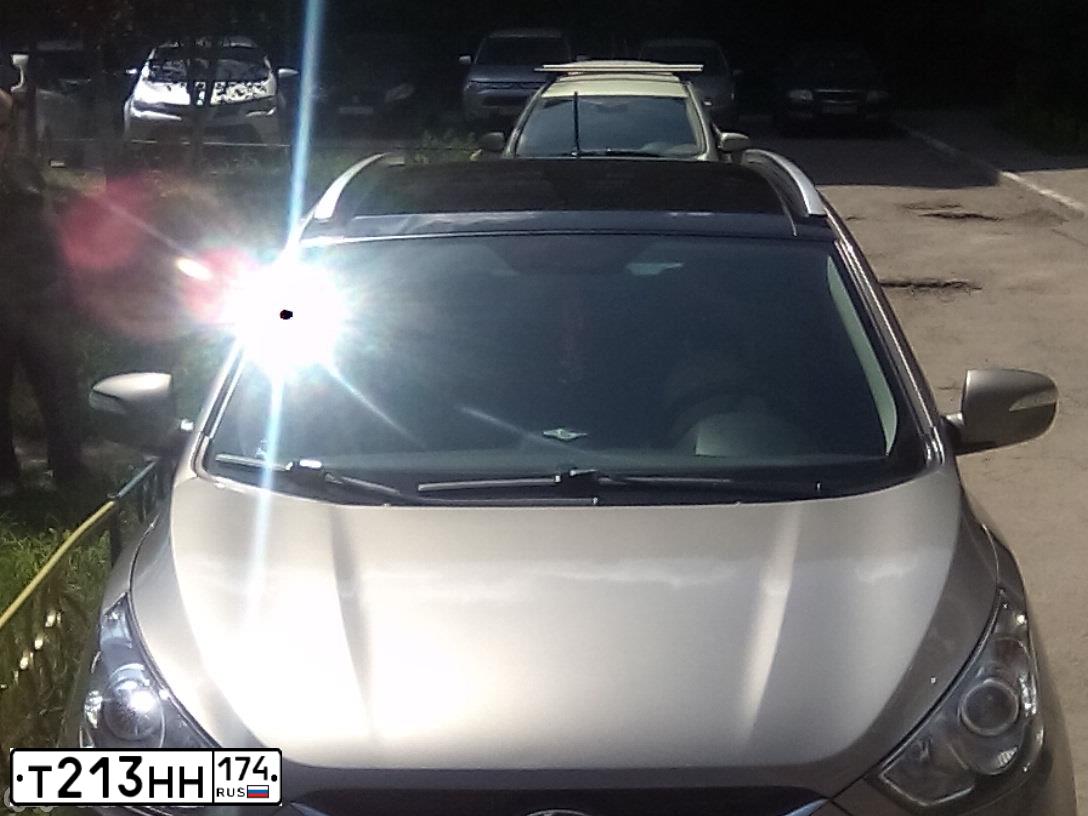 Фото автомобиля HYUNDAI IX35, 2010 — госномер Т213НН174. Цвет: СЕРО-БЕЖЕВЫЙ