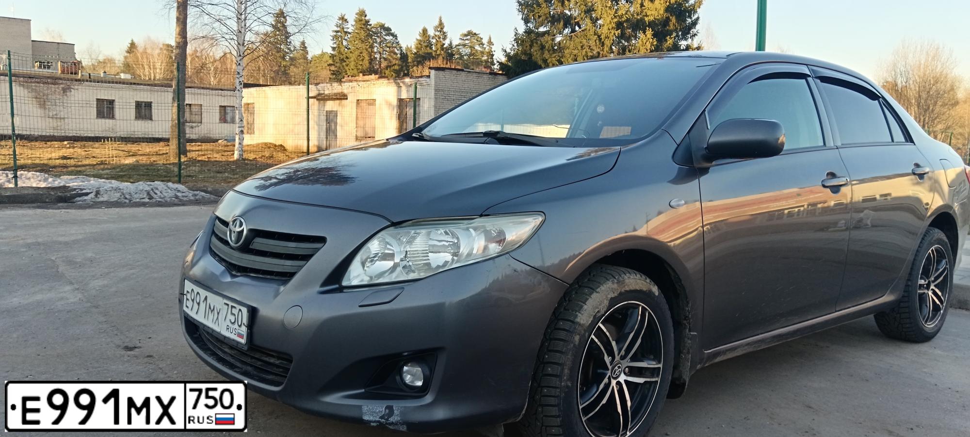 Фото автомобиля TOYOTA COROLLA, 2007 — госномер Е991МХ750. Цвет: СЕРЫЙ