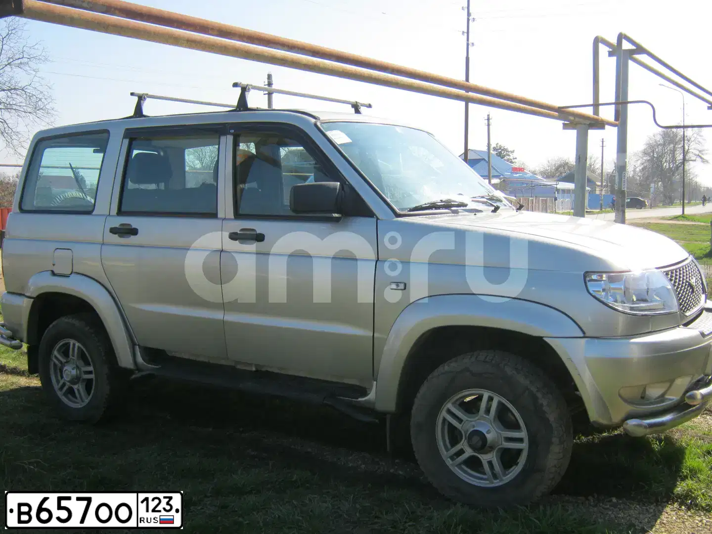Фото автомобиля UAZ PATRIOT, 2013 — госномер Х181ЕН164. Цвет: Серебристо-желтый метал