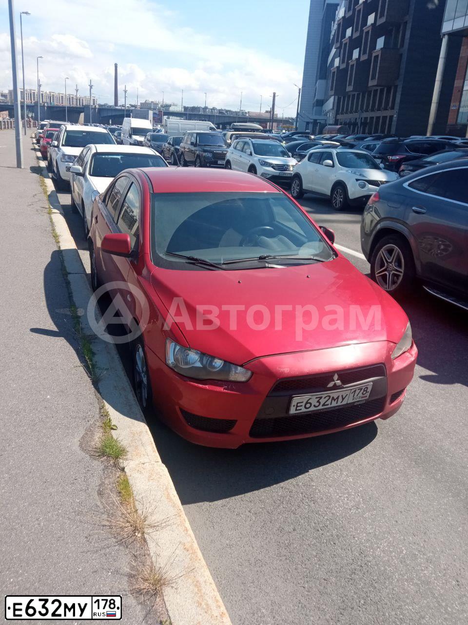 Фото автомобиля MITSUBISHI LANCER, 2008 — госномер Е632МУ178. Цвет: КРАСНЫЙ