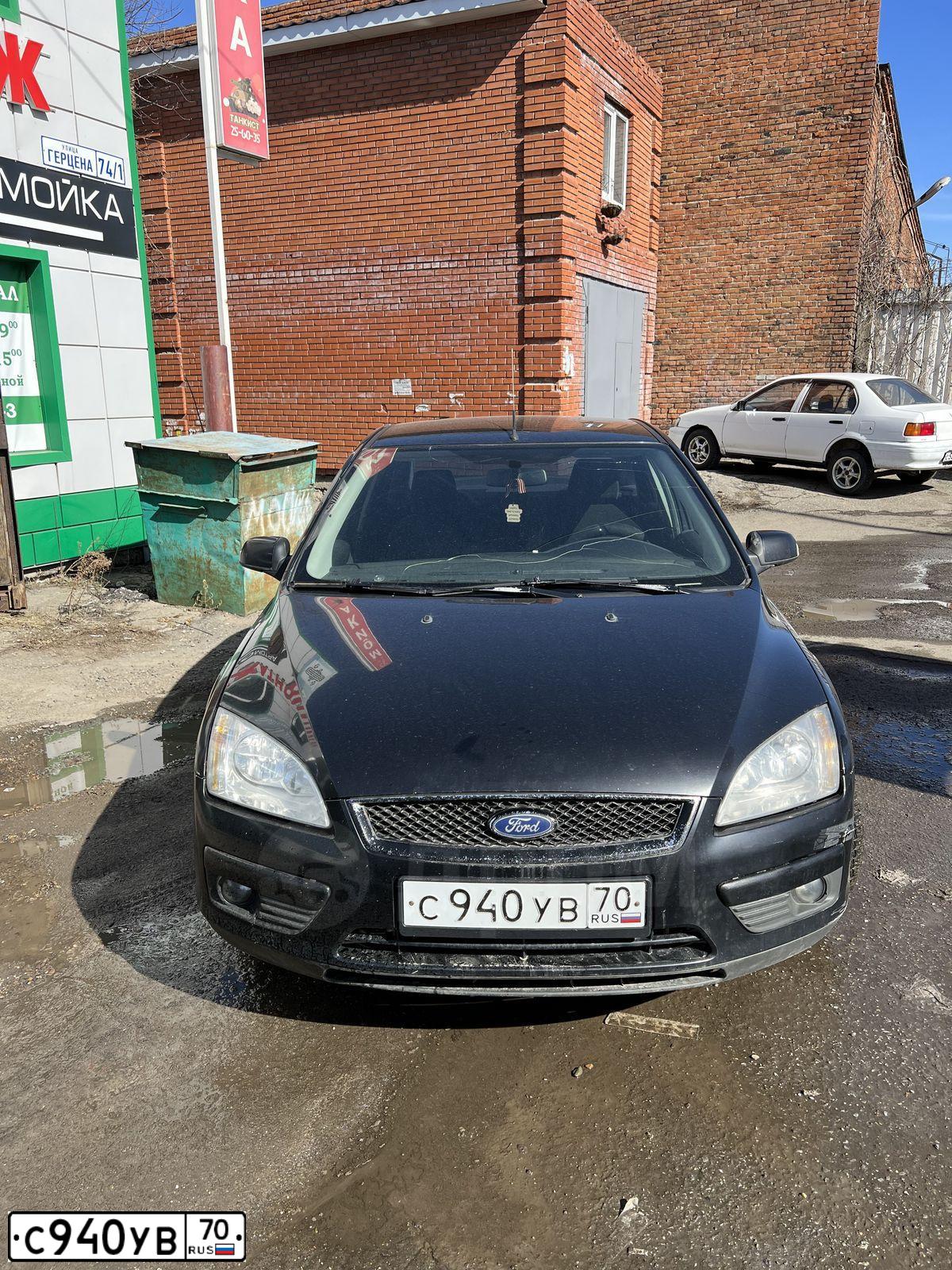 Фото автомобиля FORD FOCUS, 2007 — госномер С940УВ70. Цвет: ЧЕРНЫЙ