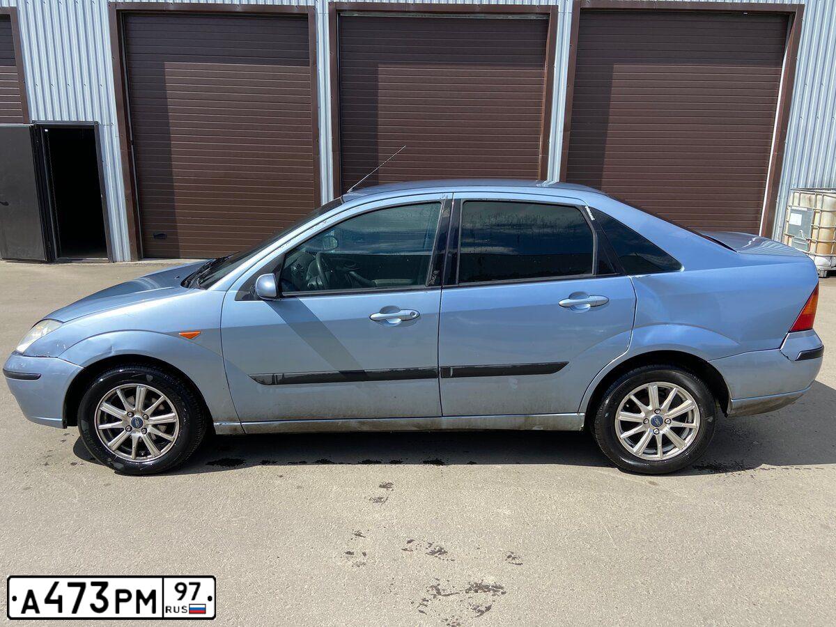Фото автомобиля FORD FOCUS, 2004 — госномер Т210ОК05. Цвет: Серо-голубой