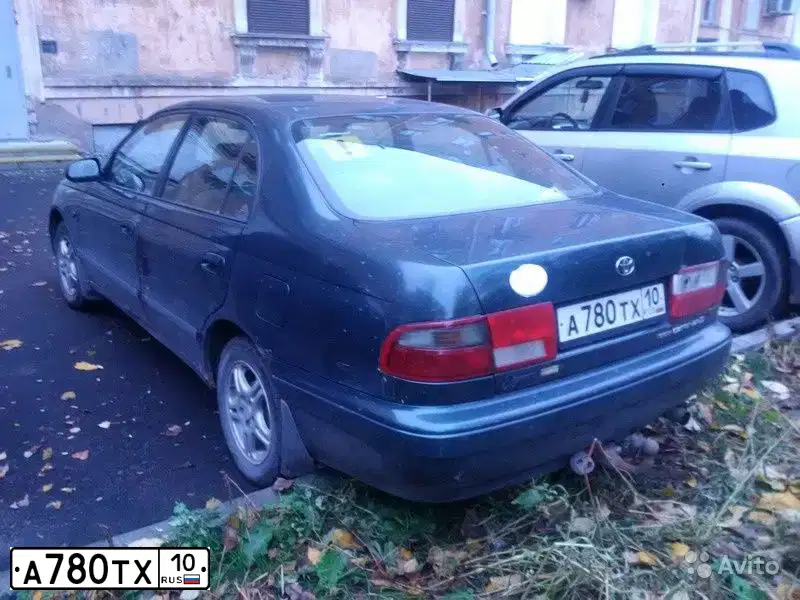 Фото автомобиля TOYOTA CARINA, 1997 — госномер А580РМ51. Цвет: ЗЕЛЕНЫЙ(ТЕМНО-ЗЕЛЕНЫЙ)