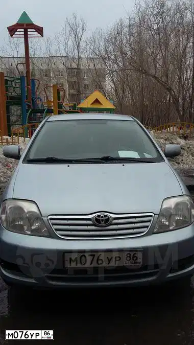 Фото автомобиля TOYOTA COROLLA, 2004 — госномер М076УР86. Цвет: СВЕТЛО-ГОЛУБОЙ