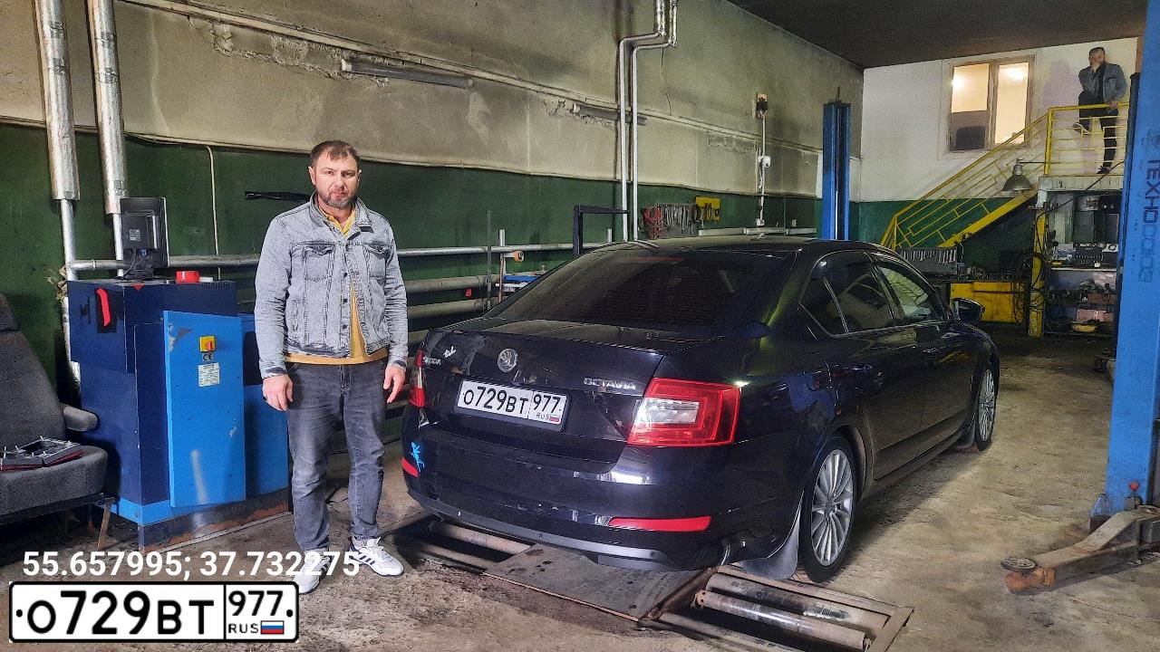 Фото автомобиля SKODA OCTAVIA, 2014 — госномер Н312ЕВ977. Цвет: ЧЕРНЫЙ