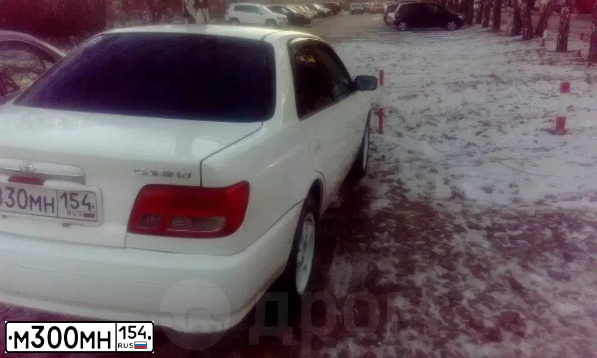 Фото автомобиля MITSUBISHI LANCER, 2010 — госномер М300МН154. Цвет: СЕРЕБРИСТЫЙ