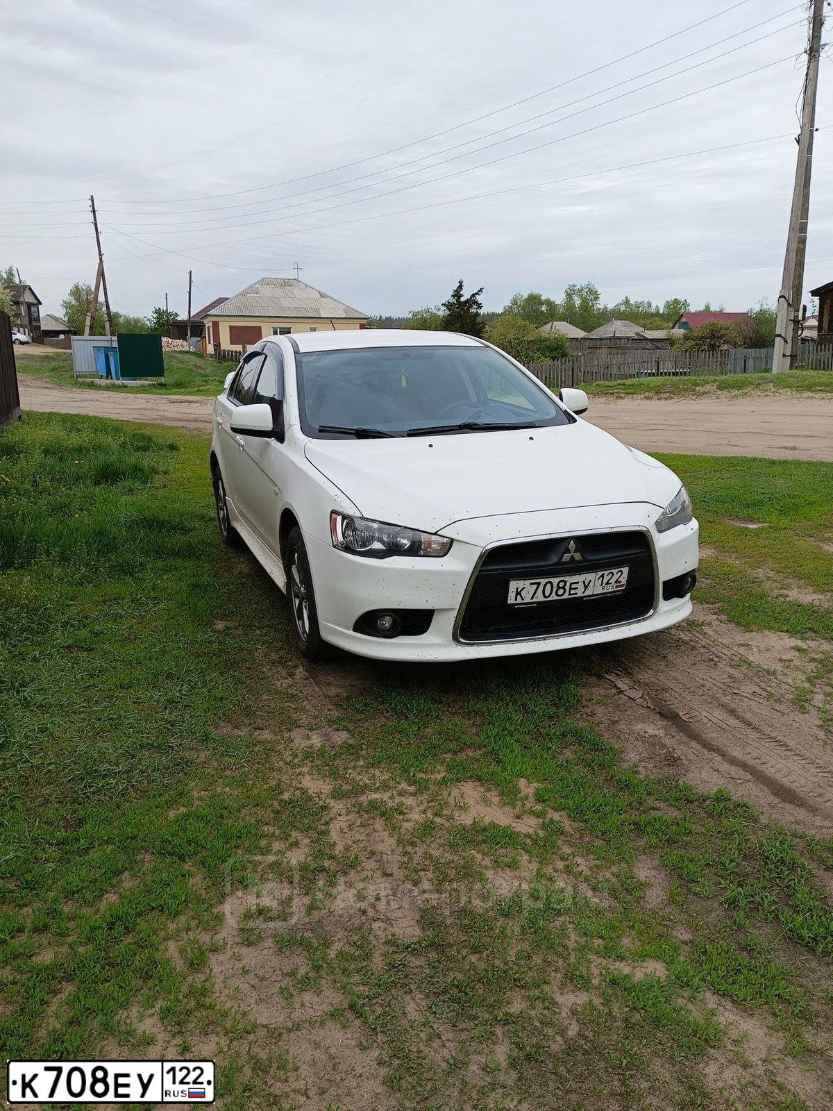 Фото автомобиля MITSUBISHI LANCER, 2012 — госномер Х089ТК22. Цвет: БЕЛЫЙ