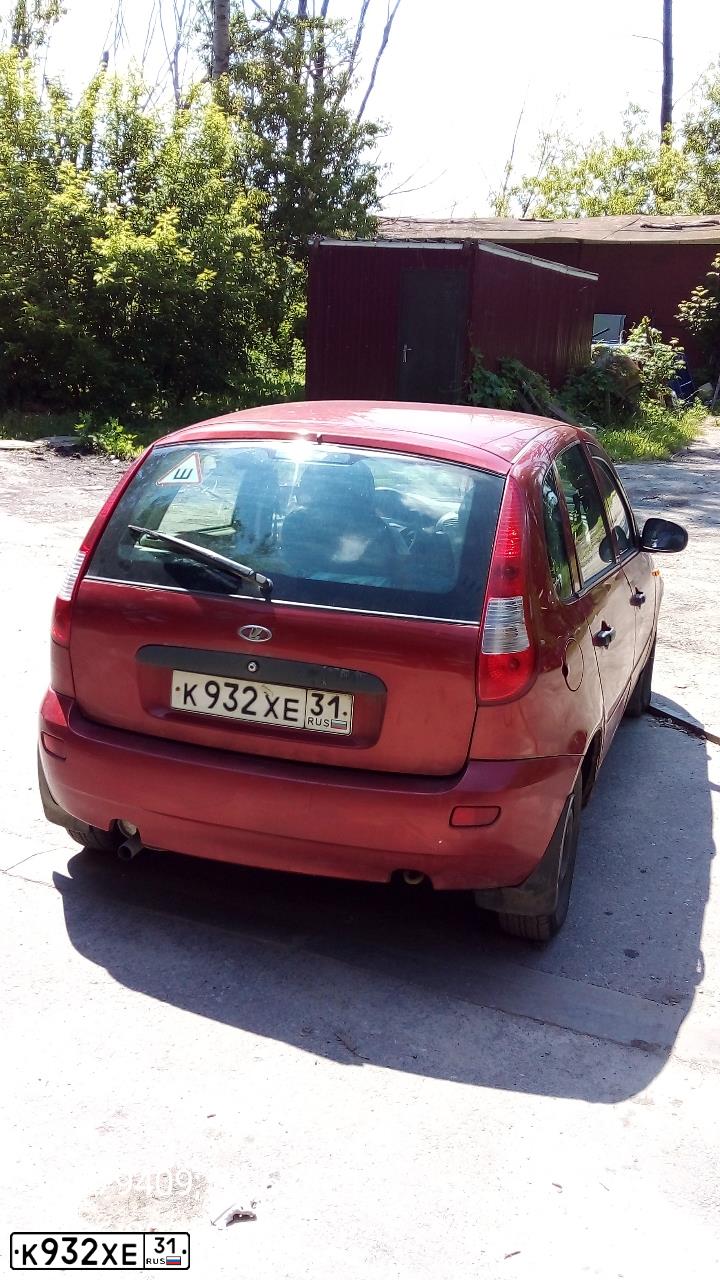 Фото автомобиля LADA 1119 KALINA, 2007 — госномер К932ХЕ31. Цвет: СЕРЕБРИСТО-КРАСНЫЙ