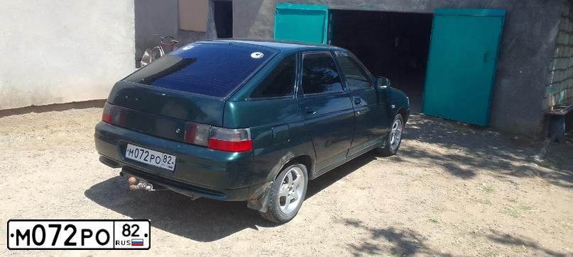 Фото автомобиля LADA 2112, 2003 — госномер М072РО82. Цвет: Темно-зеленый