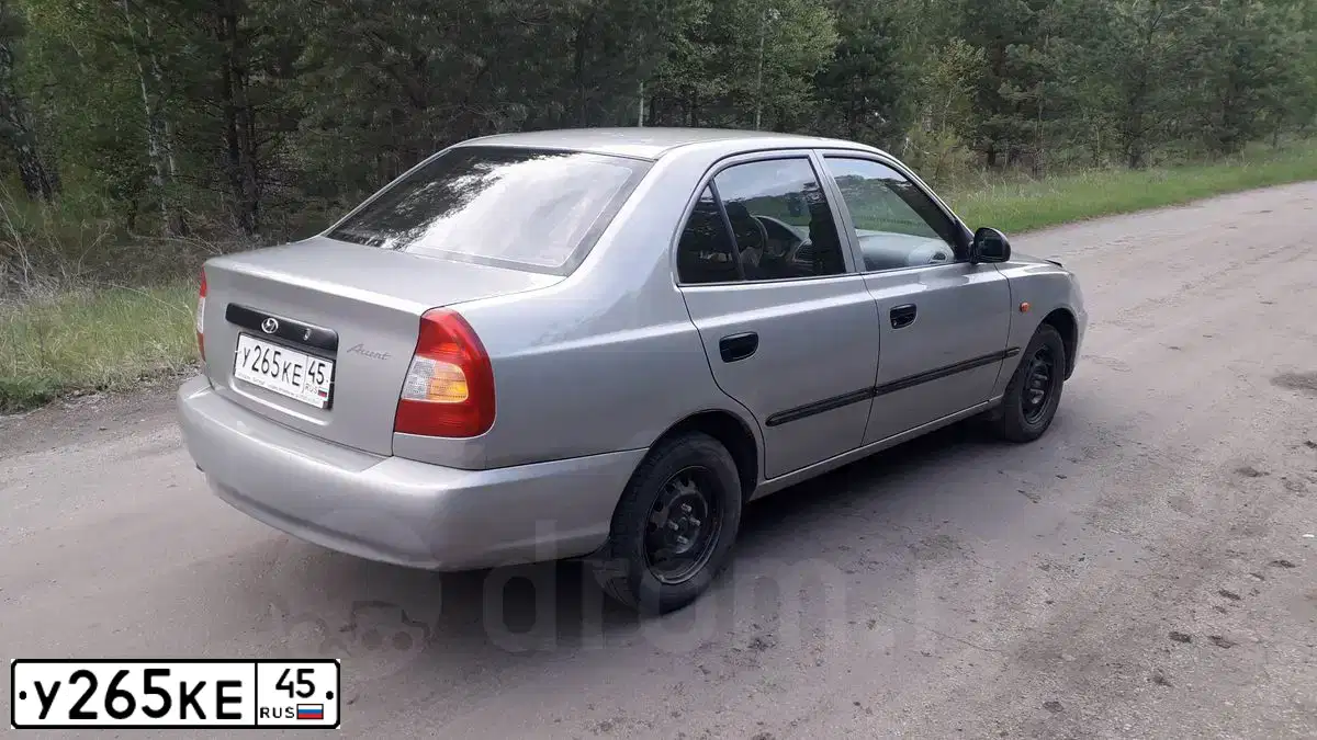 Фото автомобиля TAGAZ Z ACCENT, 2007 — госномер Е395УЕ174. Цвет: СВЕТЛО-БЕЖЕВЫЙ