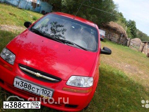 Фото автомобиля CHEVROLET AVEO, 2004 — госномер Н571ОН702. Цвет: КРАСНЫЙ
