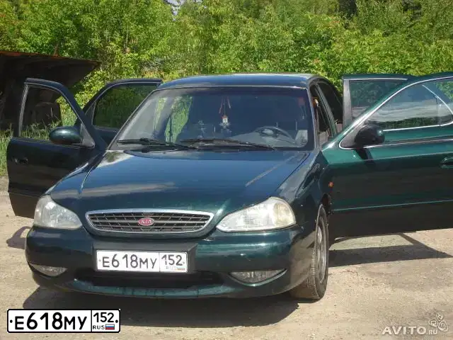 Фото автомобиля KIA CLARUS, 2000 — госномер М001НВ52. Цвет: ЗЕЛЕНЫЙ
